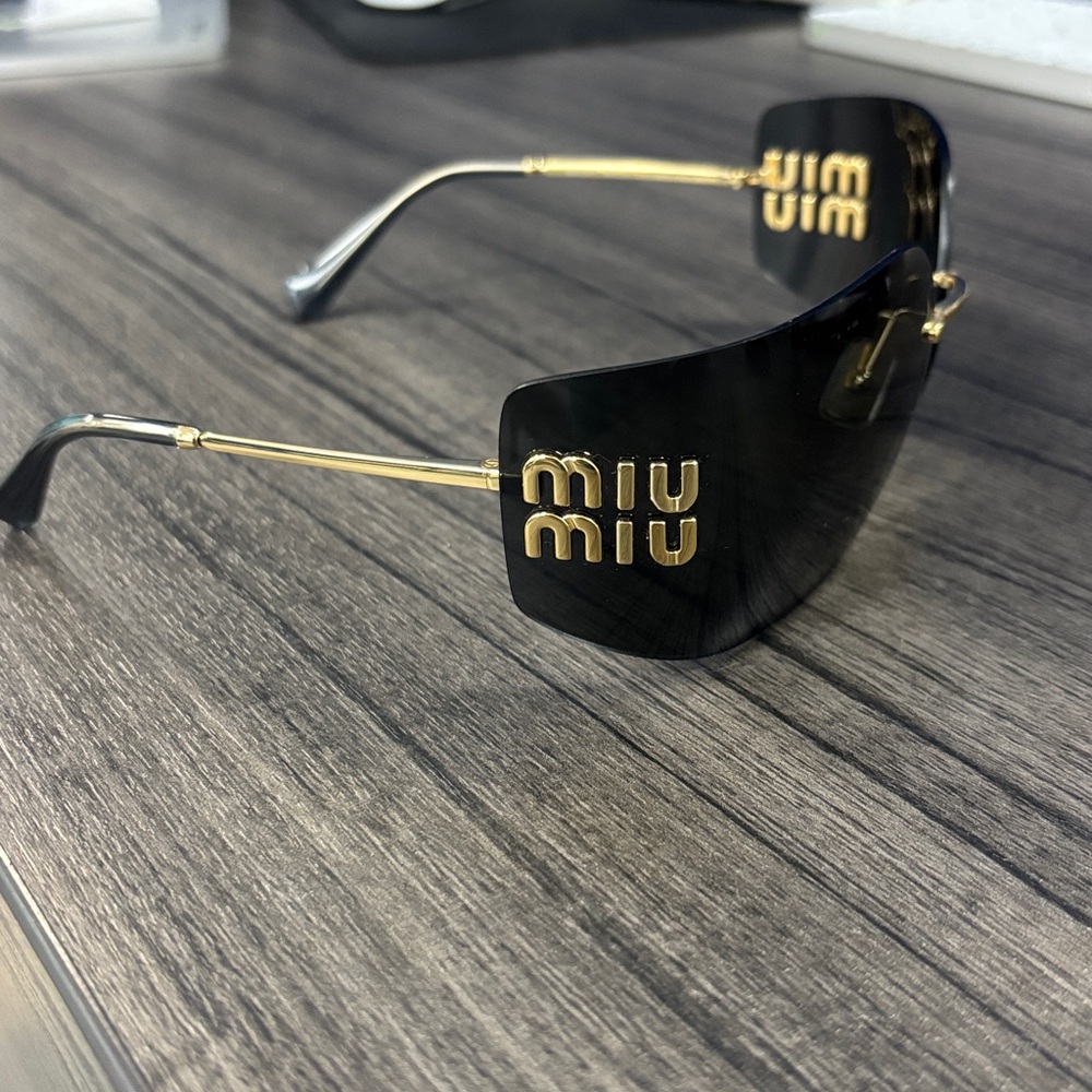 Miu Miu Black and Gold Rimless Sunglasses